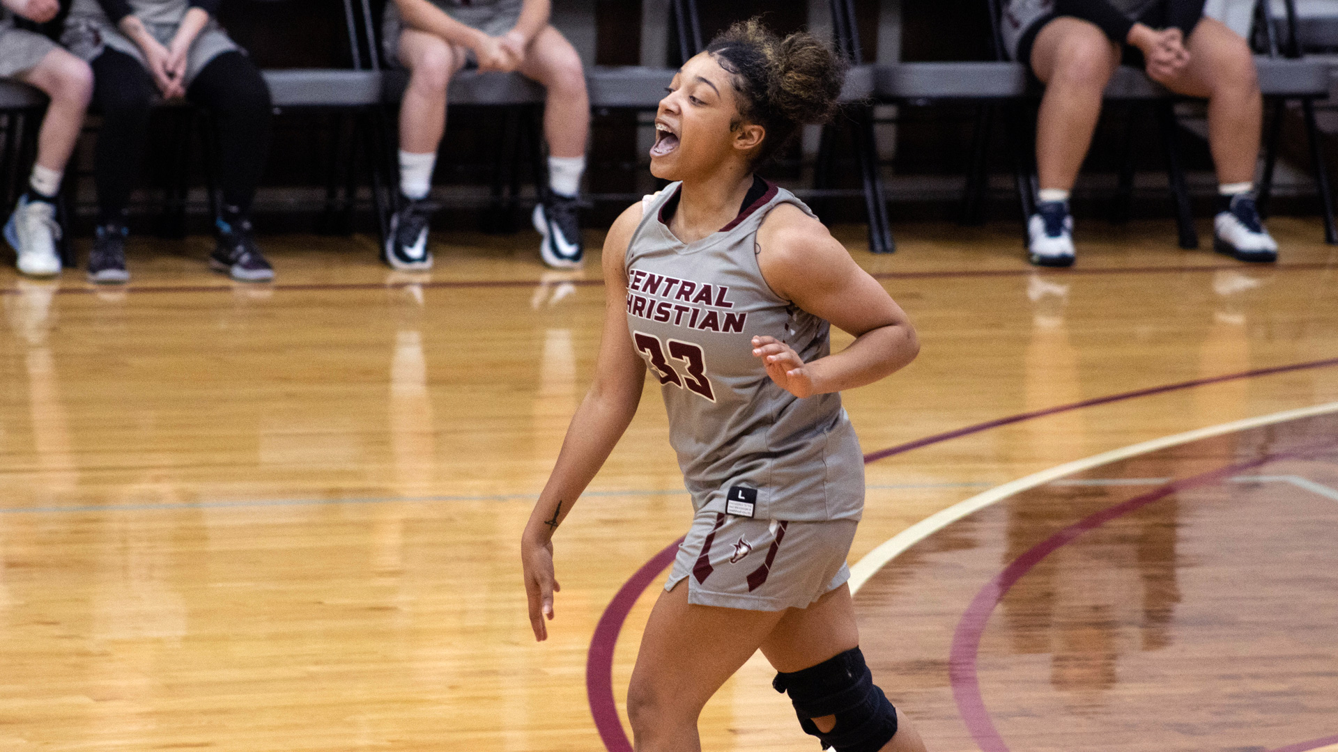 Atira Davis brings the ball up the court during the first half of the Saints' 59-46 win over Union College on Thursday.