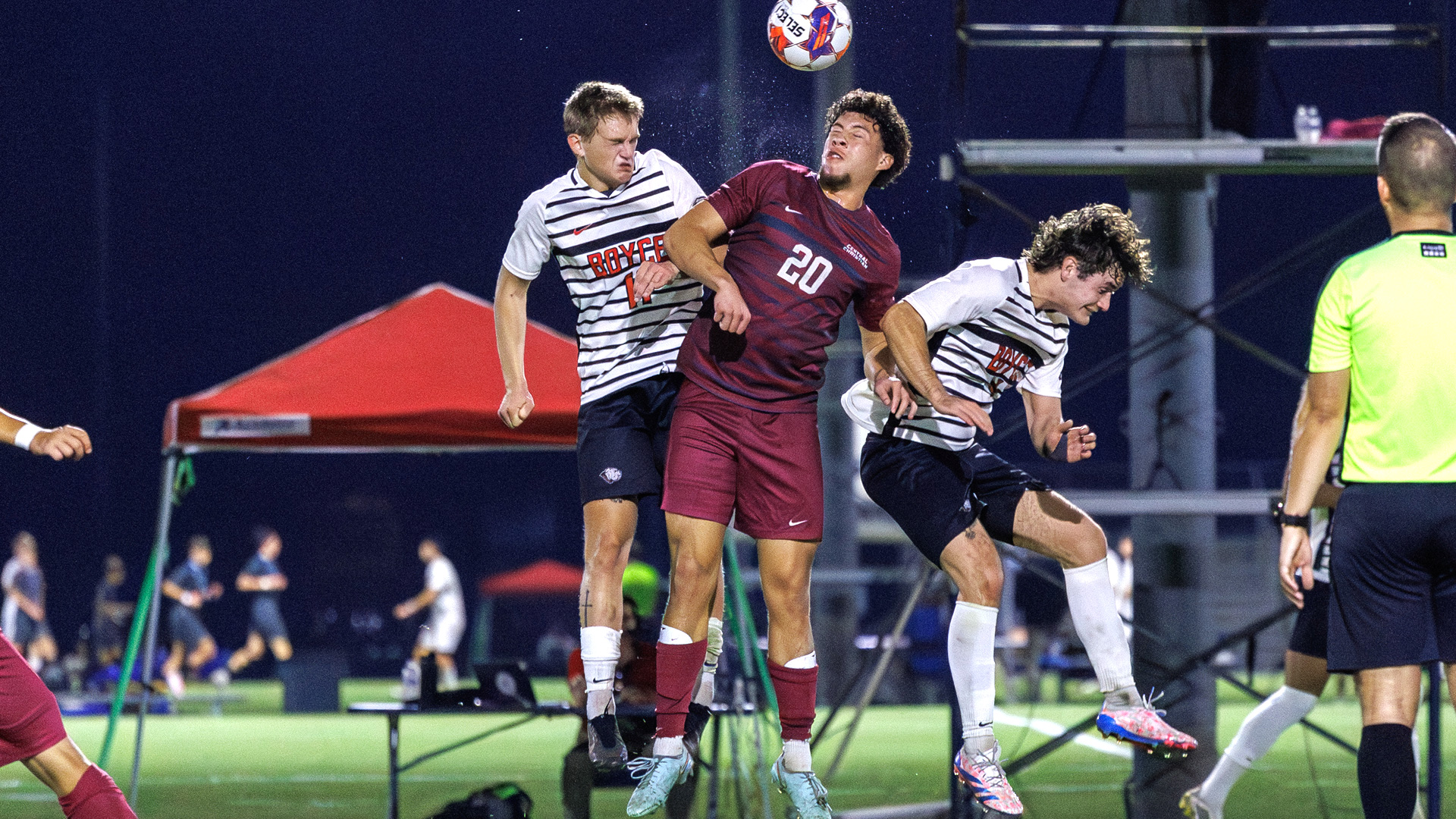 Central Christian College of the Bible's Israel Cobian rises up to head the ball away from a Boyce player on Day One of the 2025 DII Men's Soccer Championships in Kissimmee, Fla.